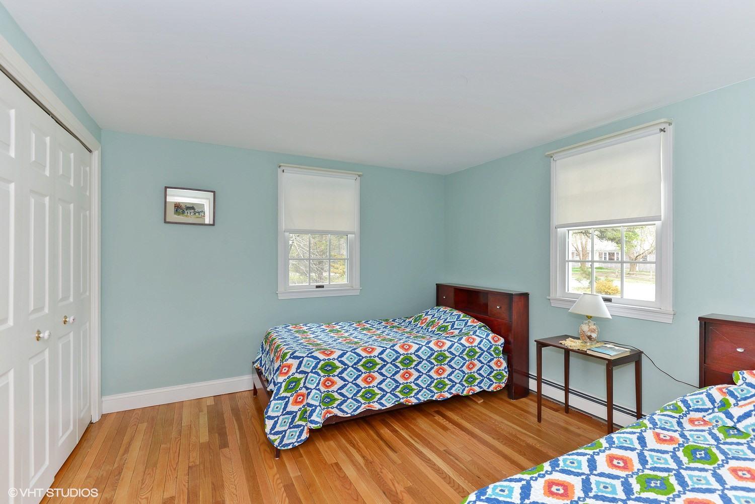 2055 Bridge Road Eastham, MA 02642 - Photo 13 of 22 a bedroom with a bed and a dresser next to a window