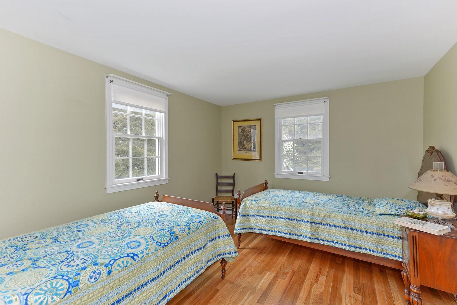 2055 Bridge Road Eastham, MA 02642 - Photo 14 of 22 a bedroom with two beds and a window