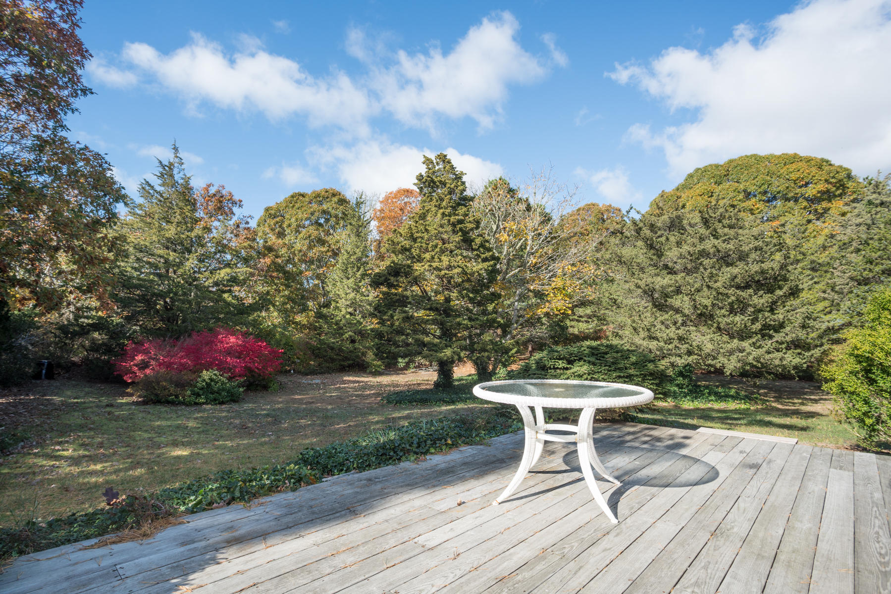 2055 Bridge Road Eastham, MA 02642 - Photo 17 of 22 a lawn chairs sitting in a yard with wooden fence