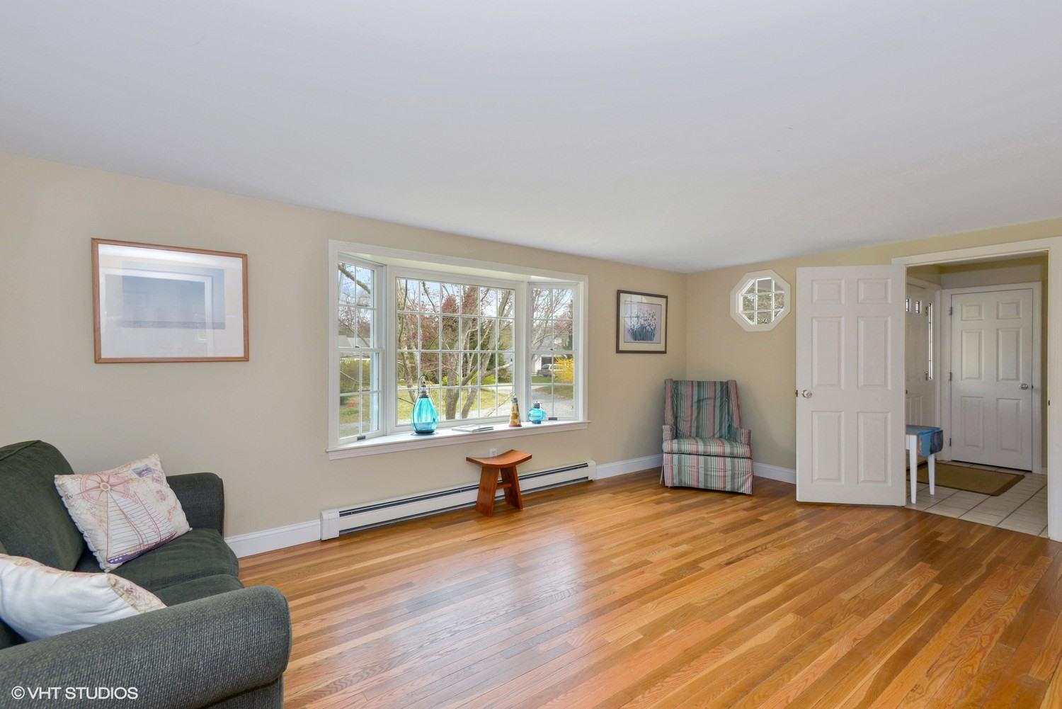 2055 Bridge Road Eastham, MA 02642 - Photo 2 of 22 a living room with furniture and a window