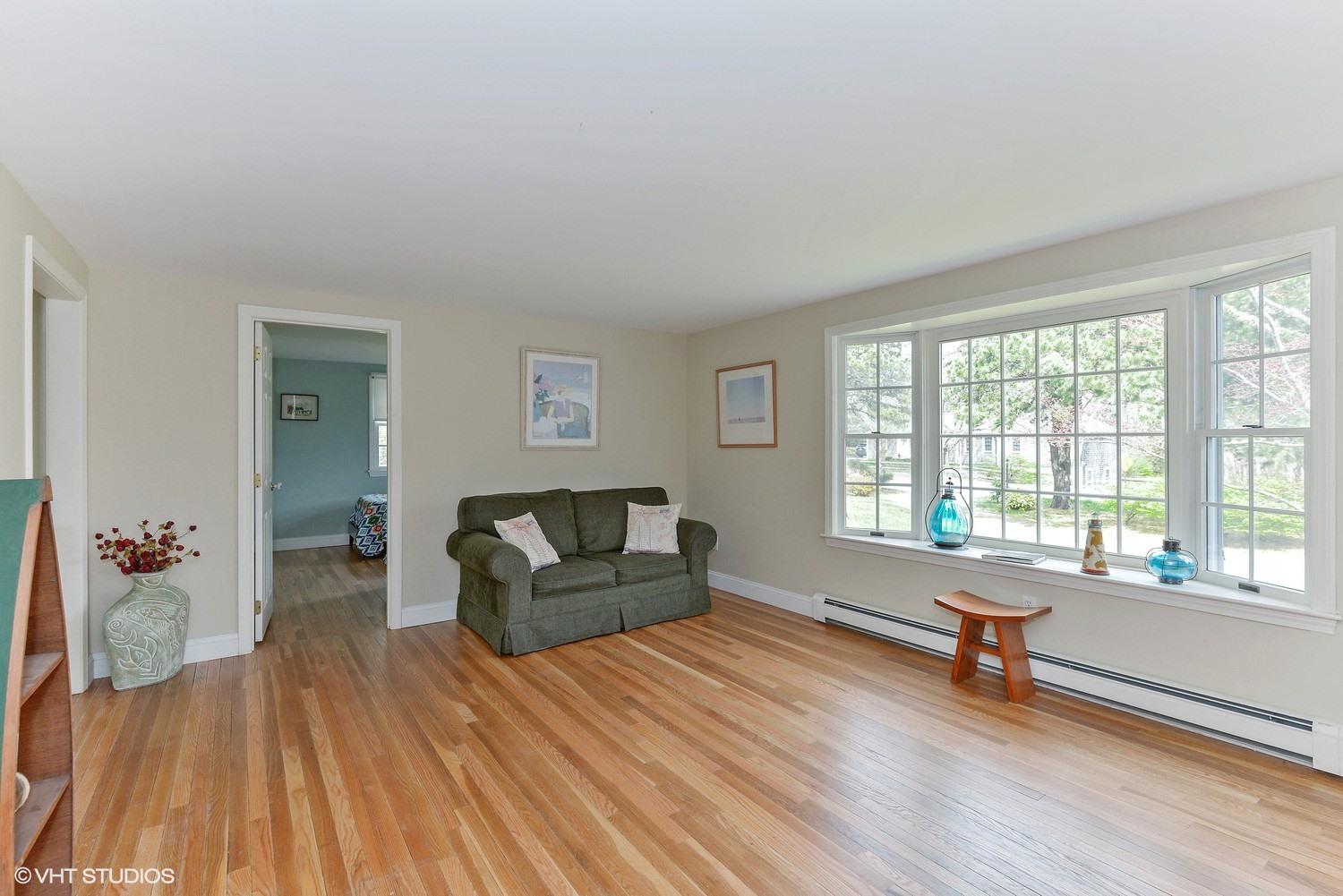 2055 Bridge Road Eastham, MA 02642 - Photo 3 of 22 a living room with furniture and wooden floor
