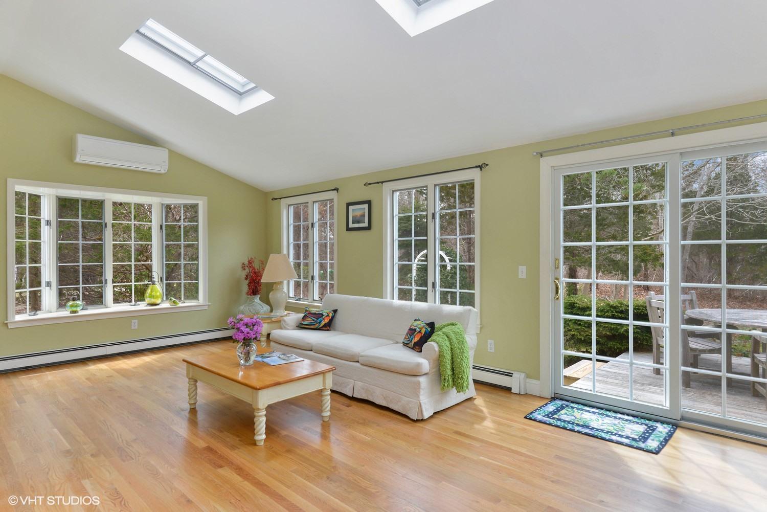 2055 Bridge Road Eastham, MA 02642 - Photo 8 of 22 a living room with furniture and a large window