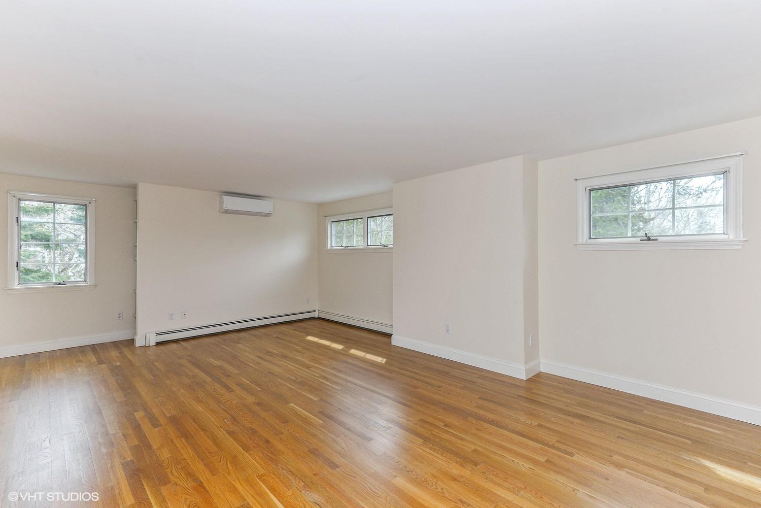 2055 Bridge Road Eastham, MA 02642 - Photo 10 of 22 an empty room with wooden floor and windows