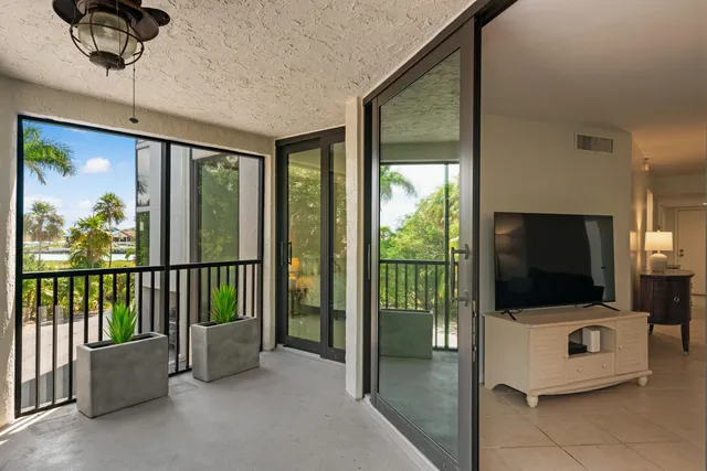 a view of a living room and a flat screen tv