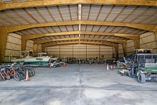 a view of parking garage with cars