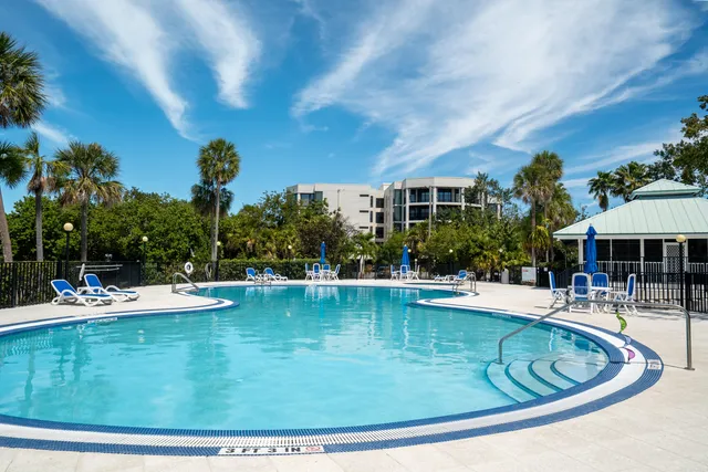 a view of a swimming pool with outdoor seating