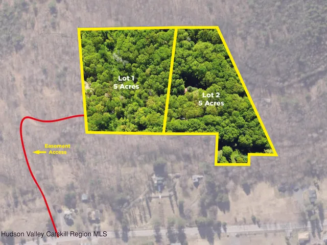 a view of a green field with lots of bushes