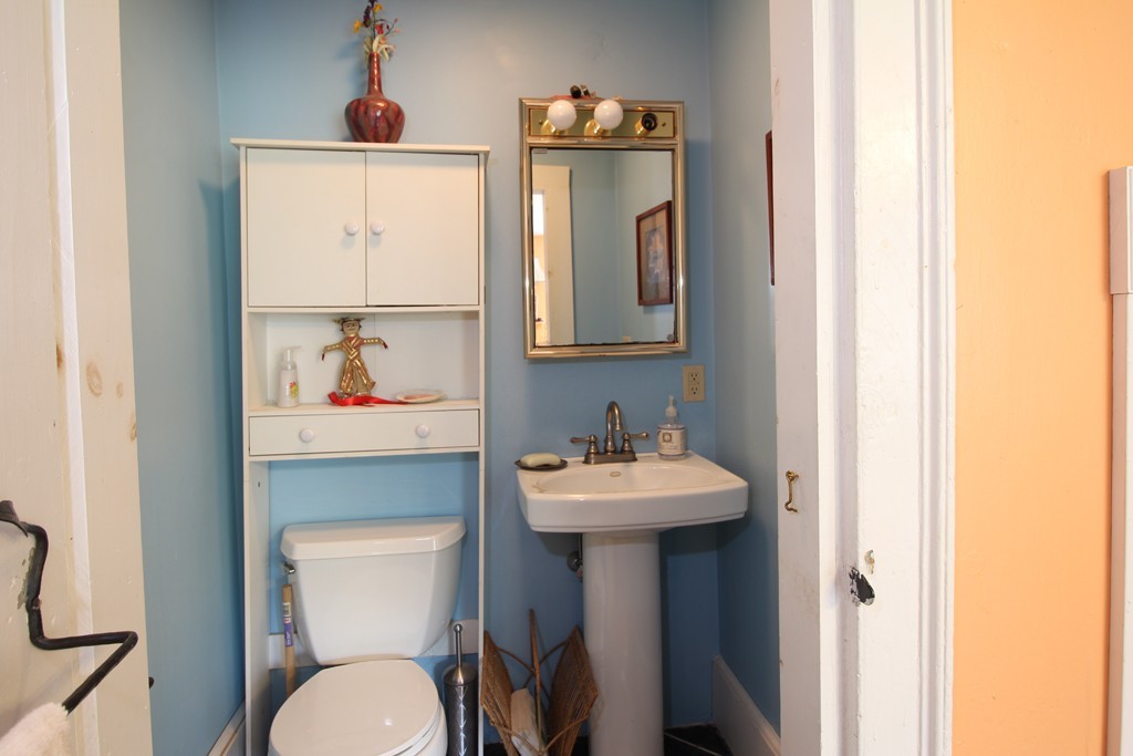 110 Ward Hill Road Phillipston, MA 01331 - Photo 14 of 16 a bathroom with a toilet sink and mirror