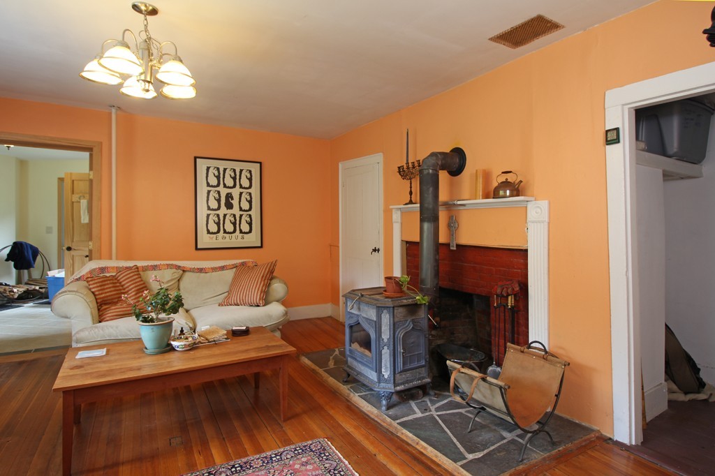 110 Ward Hill Road Phillipston, MA 01331 - Photo 5 of 16 a living room with furniture and a fireplace