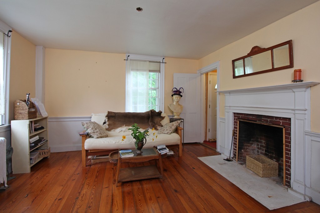 110 Ward Hill Road Phillipston, MA 01331 - Photo 9 of 16 a living room with furniture and a fireplace