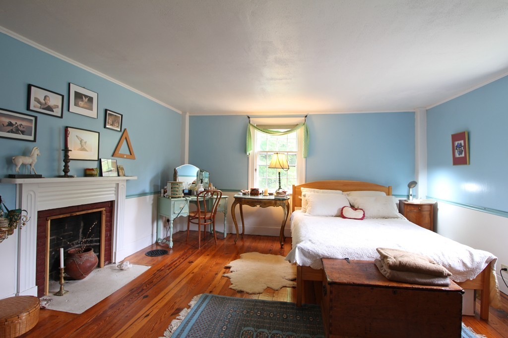 110 Ward Hill Road Phillipston, MA 01331 - Photo 10 of 16 a bedroom with a bed and a fireplace