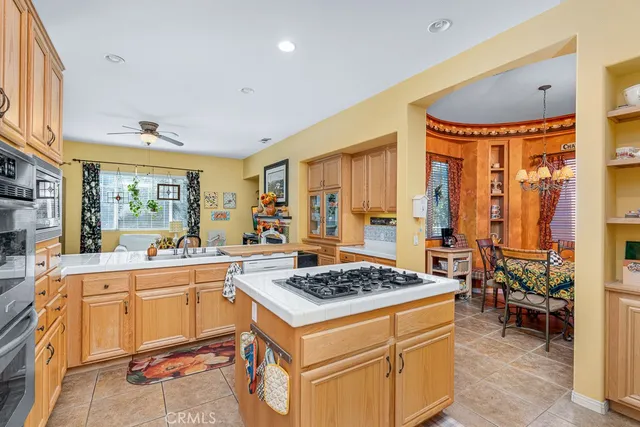a dining room with furniture and a window