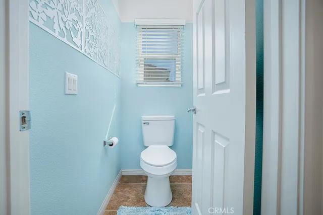 a spacious bathroom with a tub sink shower and mirror