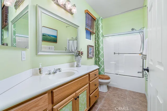 a living room with furniture toys and a window