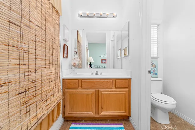 a bedroom with furniture and a book shelf