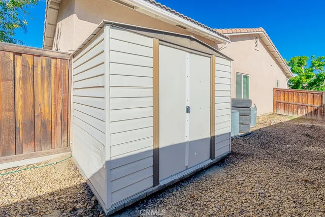 a view of a backyard with potted plants