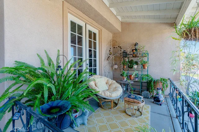 a view of a chairs and table in a patio