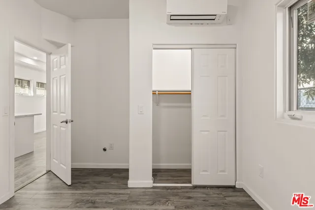 a view of entryway with wooden floor