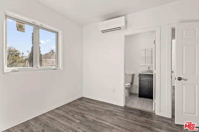 a view of a kitchen from the hallway
