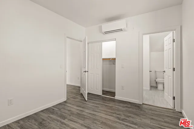 a view of a bathroom with wooden floor