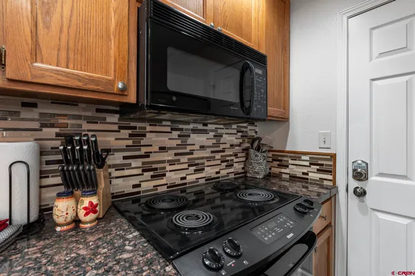 a kitchen with a stove and a microwave