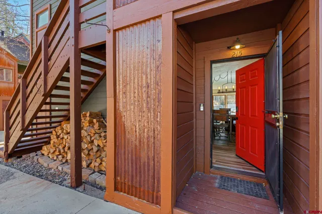 a view of a wooden door with a bench