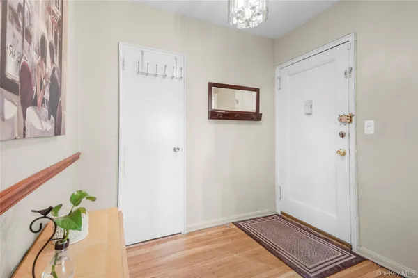 a view of an entryway with wooden floor
