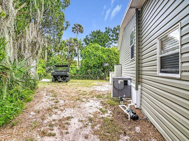 102 Ash Street Edgewater, FL 32141 - Photo 31 of 36 a backyard of a house with outdoor seating