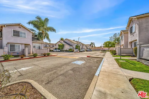 a view of multiple houses with a street