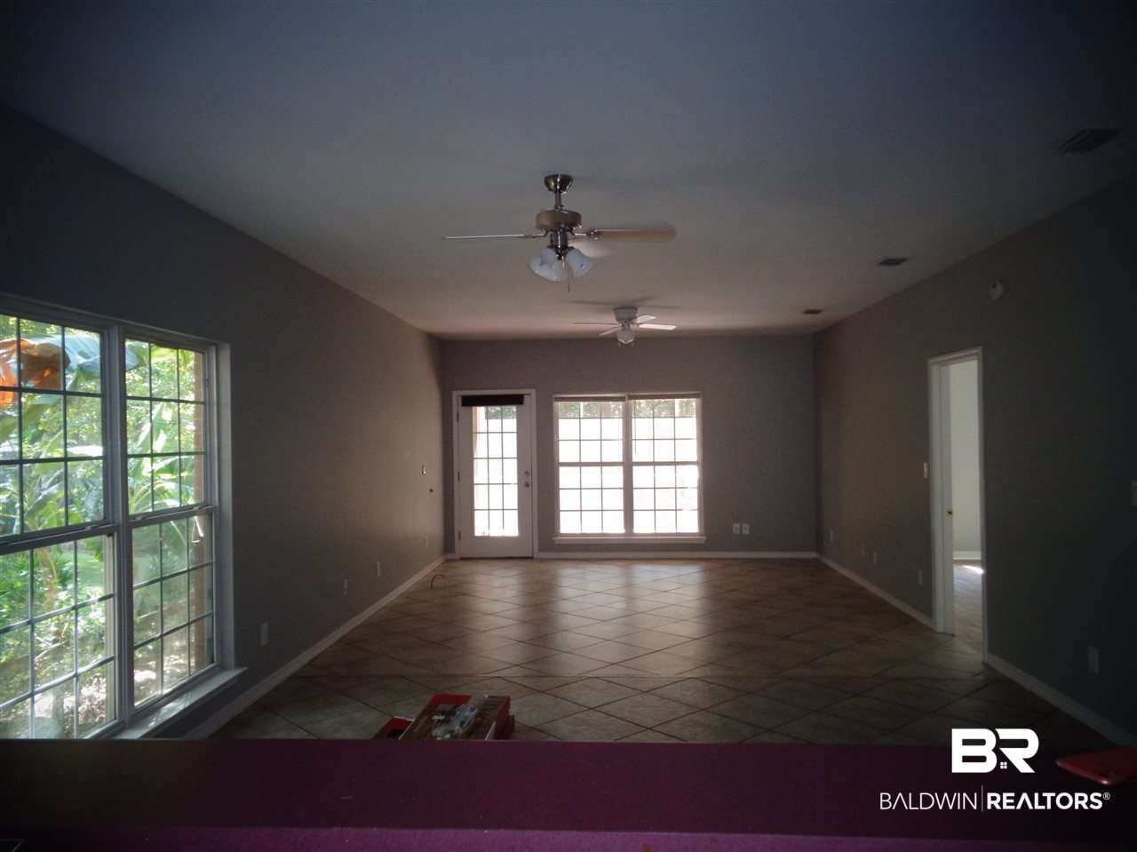 27020 Lake Road Orange Beach, AL 36561 - Photo 18 of 30 Living/Dining Room. 24x16. Tile floor.