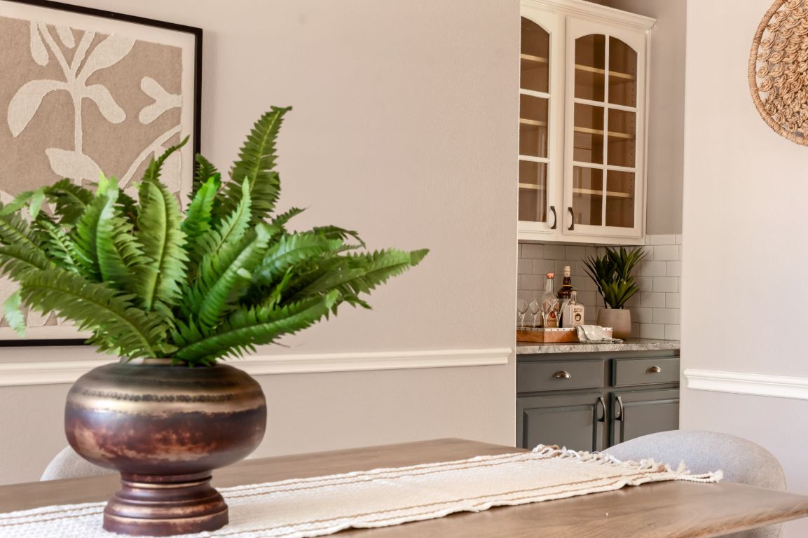 8101 Red Bird Court Austin, TX 78726 - Photo 16 of 33 a vase of flowers sitting on a table