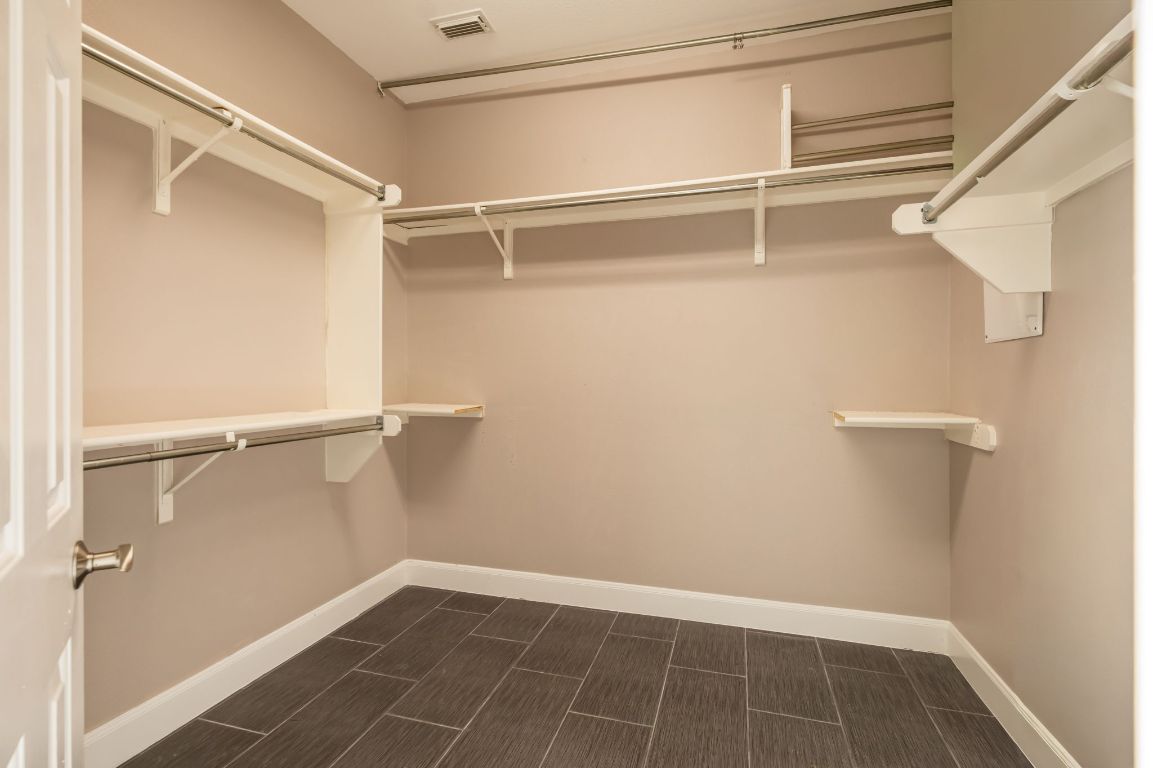 8101 Red Bird Court Austin, TX 78726 - Photo 24 of 33 a view of an empty walk in closet