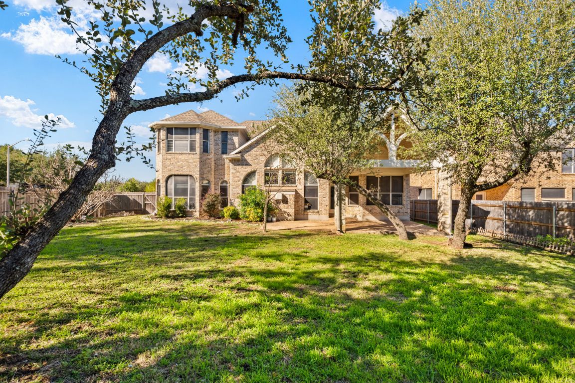 8101 Red Bird Court Austin, TX 78726 - Photo 33 of 33 a view of a house with a big yard and large trees