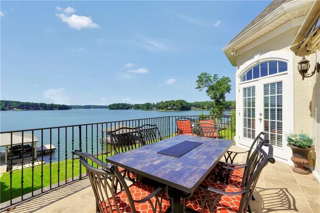 a kitchen with stainless steel appliances granite countertop a sink and dishwasher cabinets with wooden floor