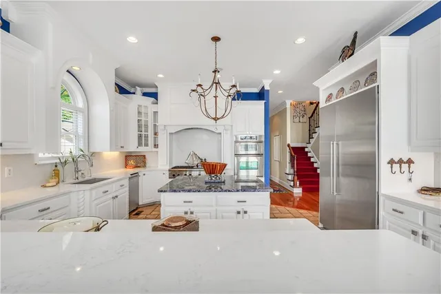 a bathroom with a sink a toilet and shower curtain