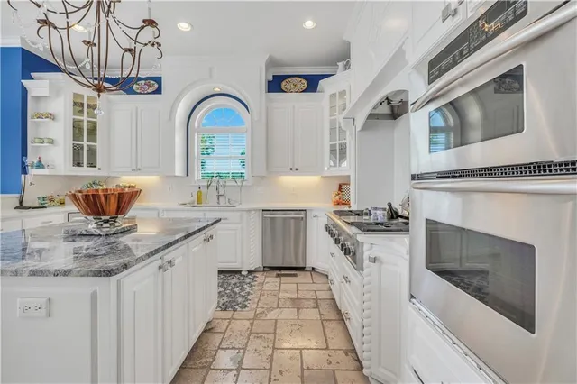 a white toilet sitting next to a bathroom