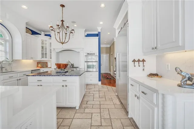 a view of washer and dryer with kitchen in the background