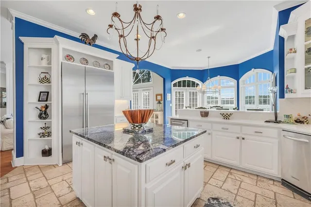 a view of a patio with a table chairs and backyard