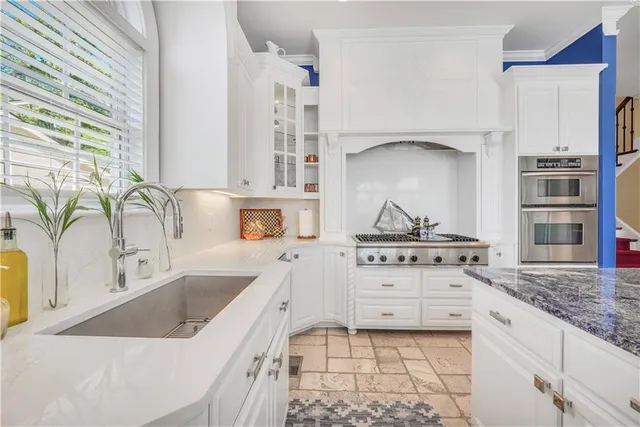 a view of a flower in a garden with a building