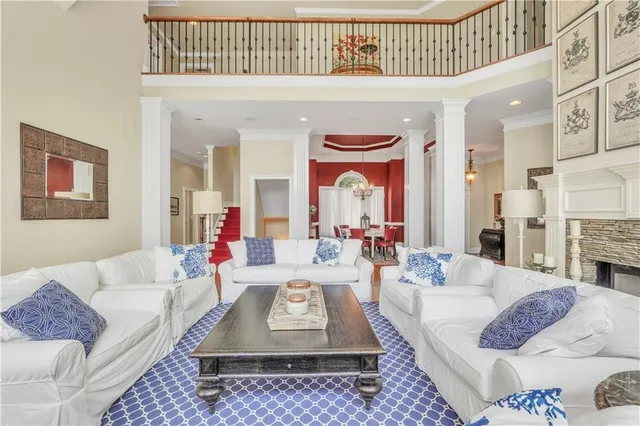 an aerial view of a house with a yard and lake view