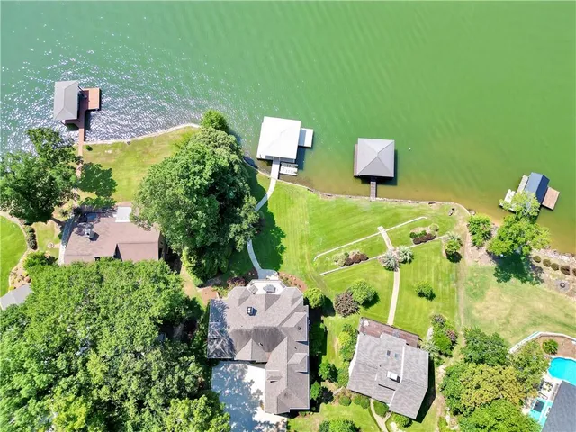 a kitchen with granite countertop a sink stove and cabinets