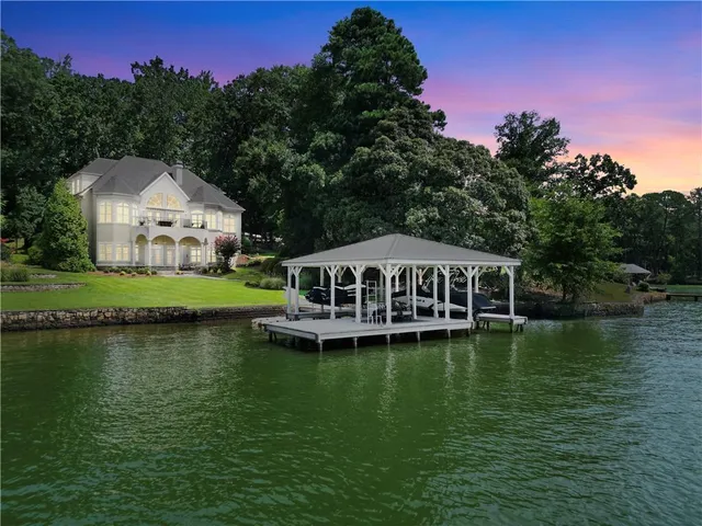a living room with furniture a rug and a window