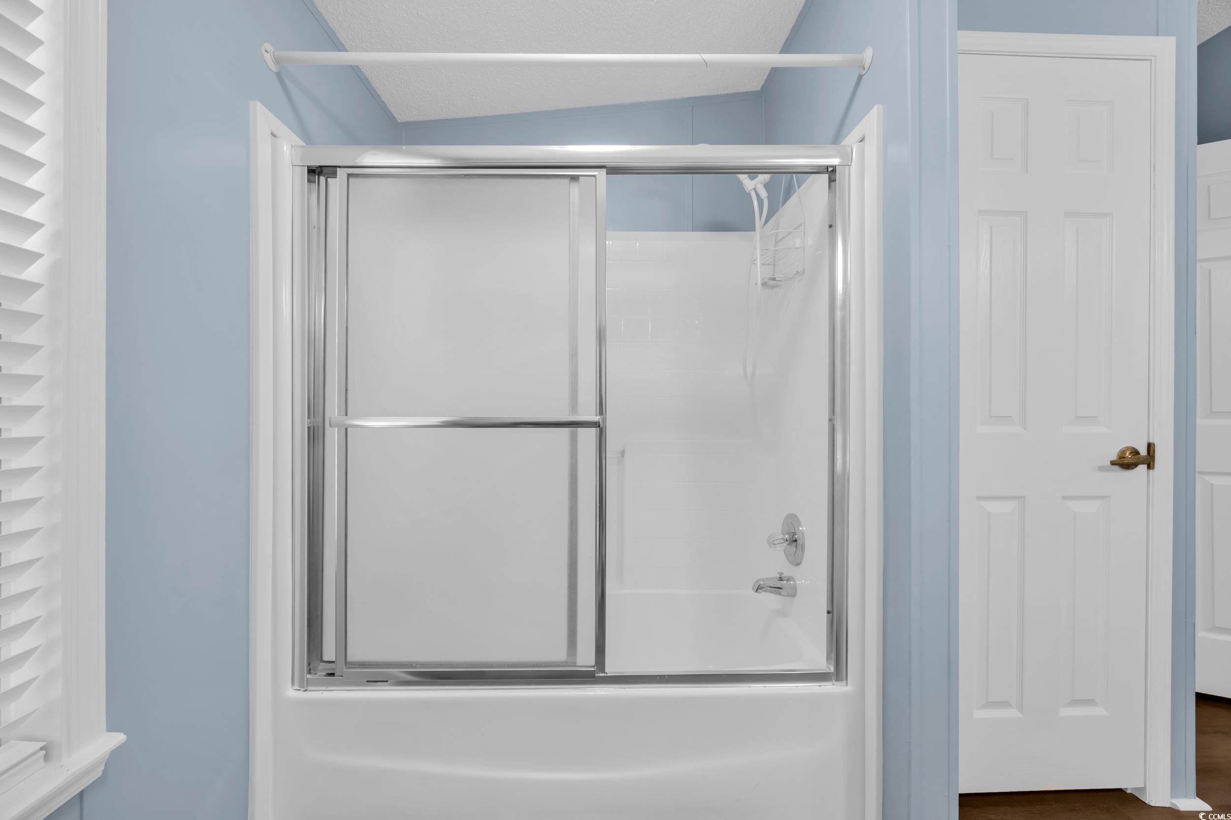 3373 Lake Pond Road Loris, SC 29569 - Photo 17 of 33 Bathroom featuring shower / bath combination with glass door