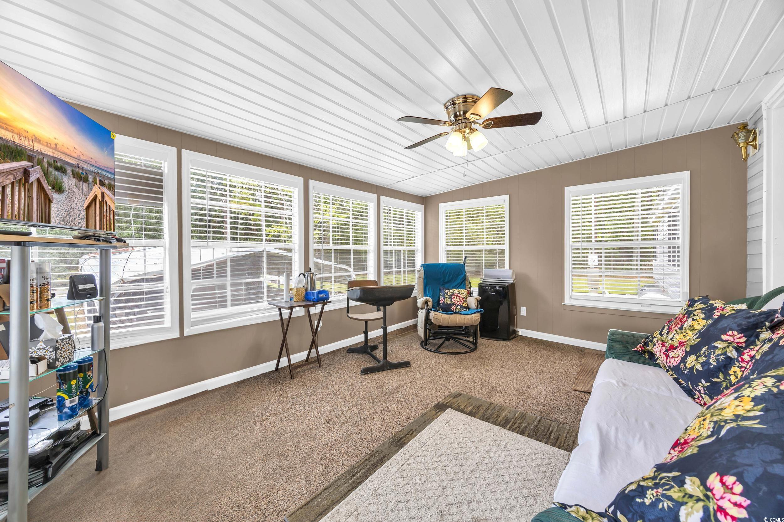 3373 Lake Pond Road Loris, SC 29569 - Photo 20 of 33 Sunroom featuring carpet flooring and wood ceiling