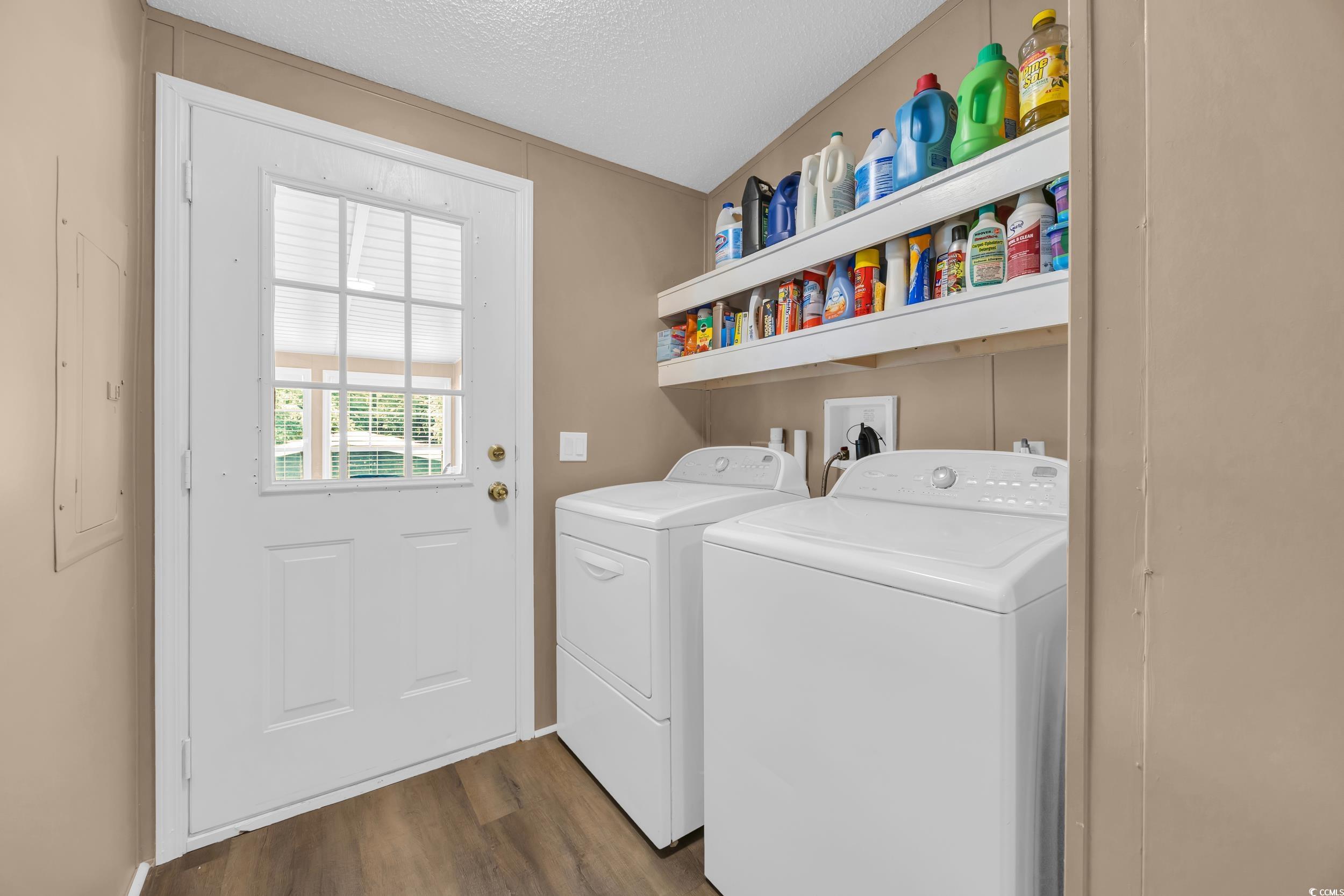 3373 Lake Pond Road Loris, SC 29569 - Photo 21 of 33 Laundry room with independent washer and dryer, a textured ceiling, dark wood finished floors, and electric panel