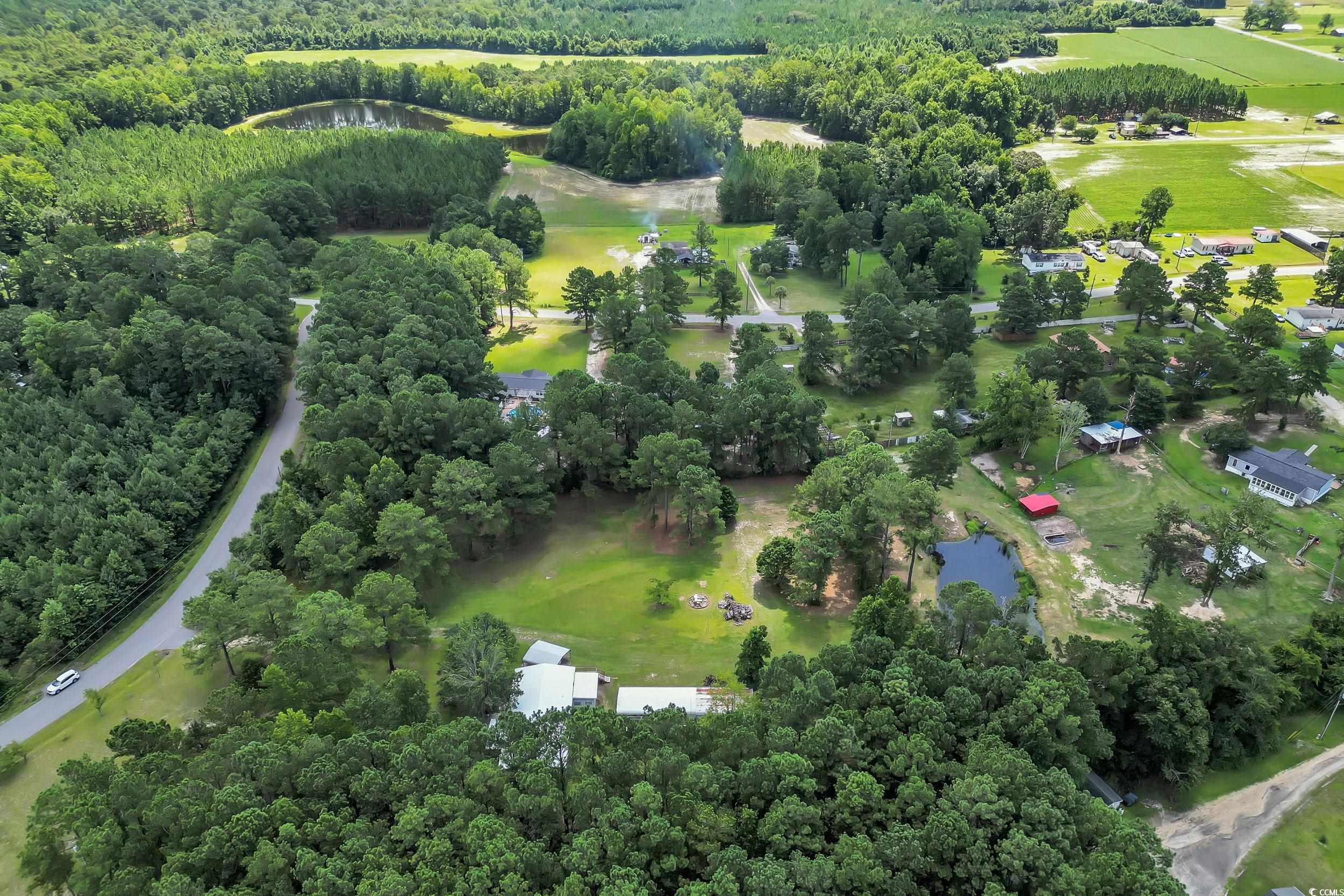 3373 Lake Pond Road Loris, SC 29569 - Photo 31 of 33 Drone / aerial view of a nearby body of water