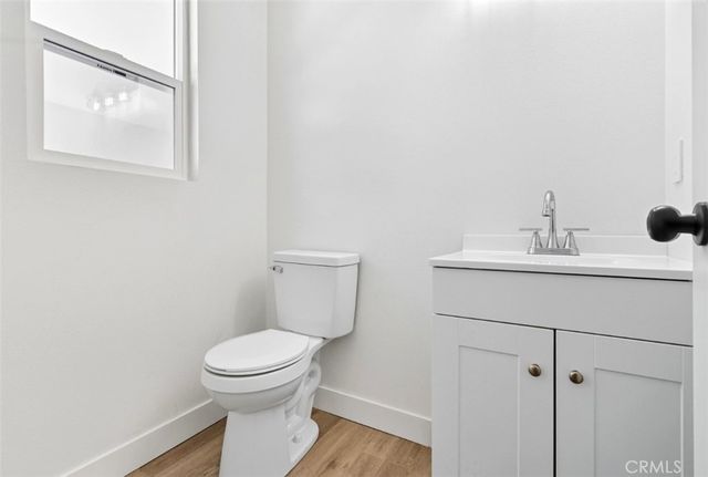 a view of a pathway of a house with wooden floor