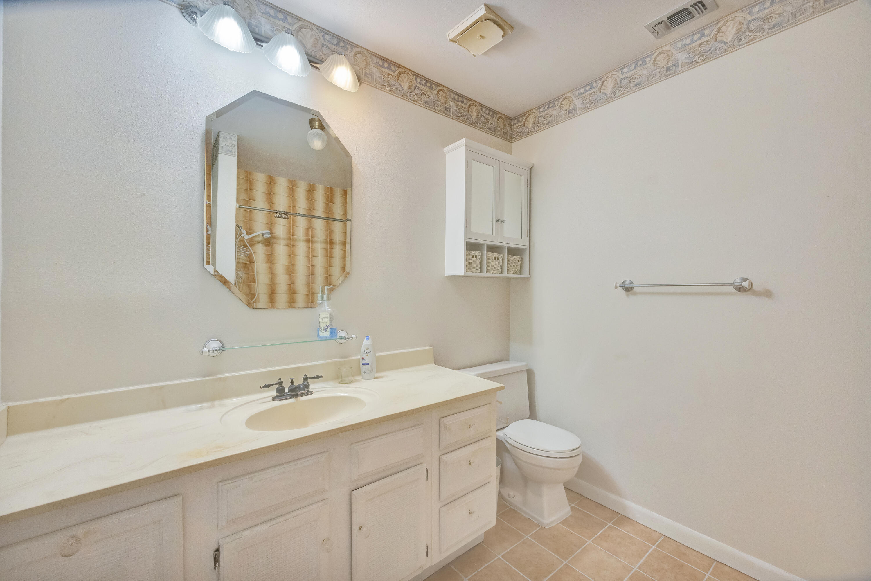 2540 Taylor Road Crestview, FL 32536 - Photo 24 of 75 a bathroom with a toilet a sink a mirror and a shower