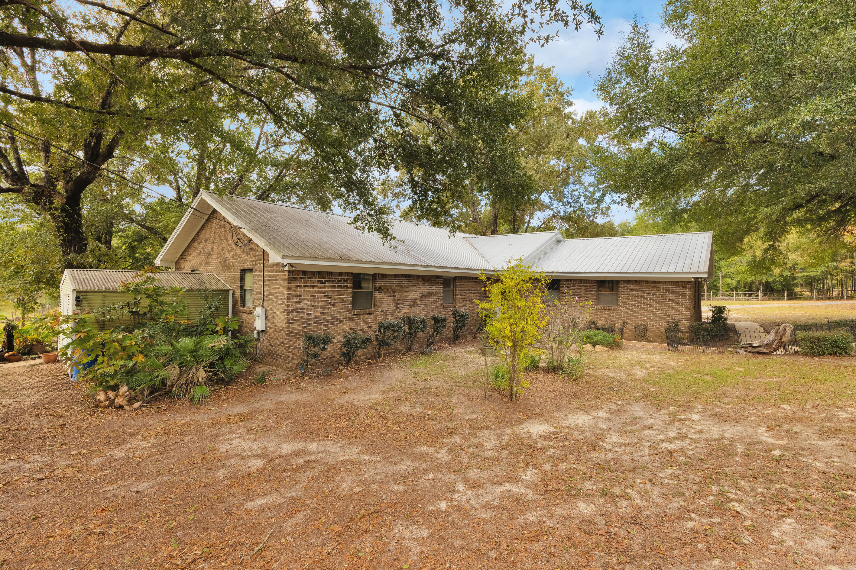 2540 Taylor Road Crestview, FL 32536 - Photo 3 of 75 a front view of a house with a yard and garage