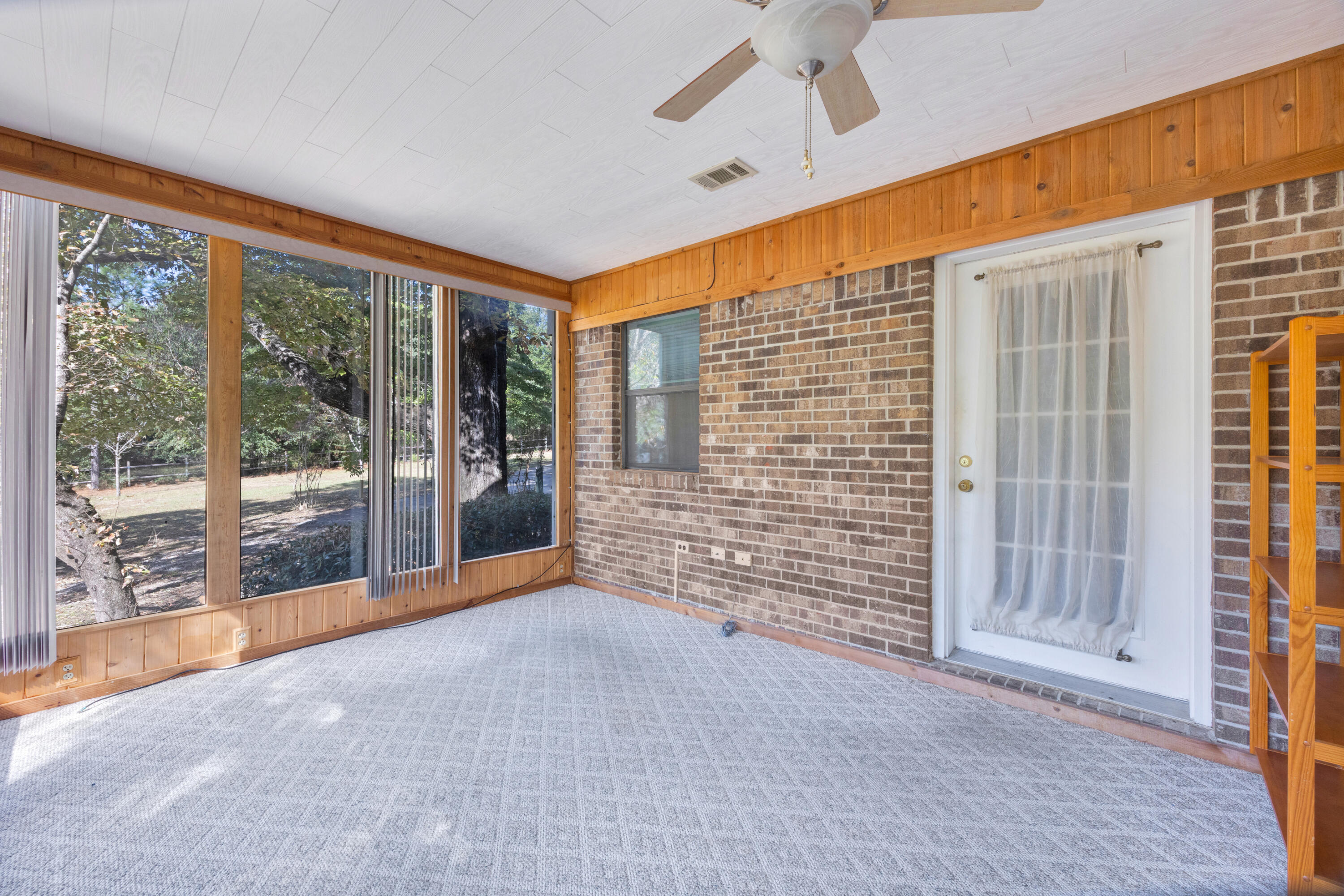 2540 Taylor Road Crestview, FL 32536 - Photo 39 of 75 a view of an empty room with a fireplace and a window